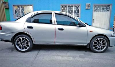 Mazda 323 • 1997 • 100,000 km